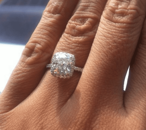 Harry Winston halo diamond engagement ring.