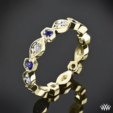 Odyssey diamond and blue sapphire right hand ring set in 18K yellow gold at Whiteflash.