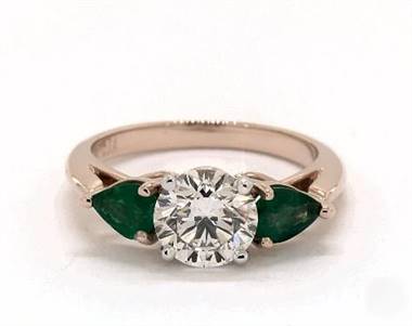 A Pear-Emerald 3-Stone Engagement Ring set in 14K Rose Gold.