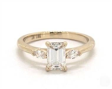 A 3-Stone Marquise Diamond Engagement Ring set in 14K Yellow Gold.