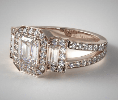 An Emerald Cut 3-Stone Split Shank Engagement Ring in 14K Rose Gold.