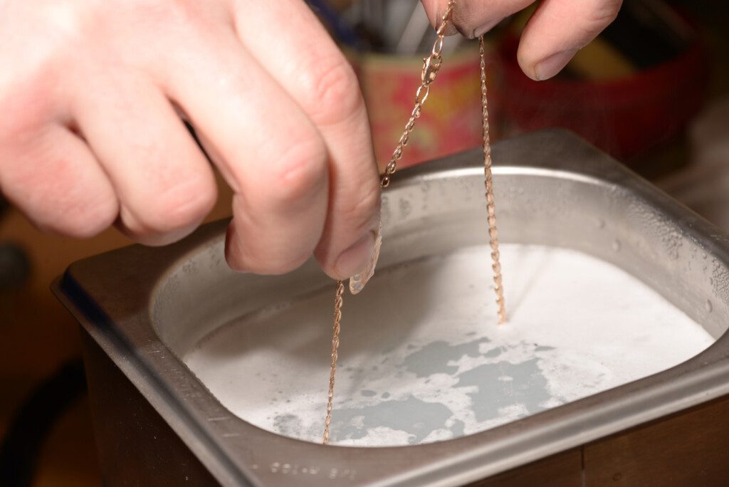 Cleaning jewelry in an ultrasonic cleaner.