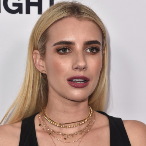 Emma Roberts wearing a Layered Gold Necklace.