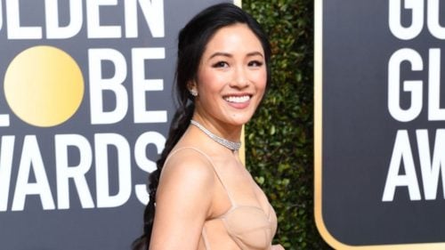 onstance Wu on the Golden Globes Red Carpet in a Nude Vara Wang gown, with diamond choker