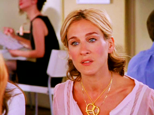 Carrie wearing a pretzel pendant