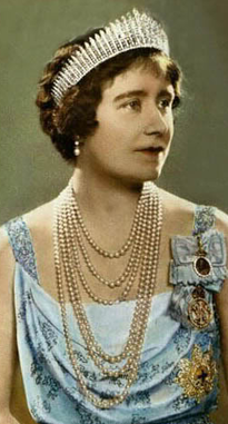 Colorized image of Queen Elizabeth (The Queen Mother) as a young Queen in strands of pearls, a blue gown with her medals and pins, and the Queen Mary Fringe Tiara on her short brunette hair.