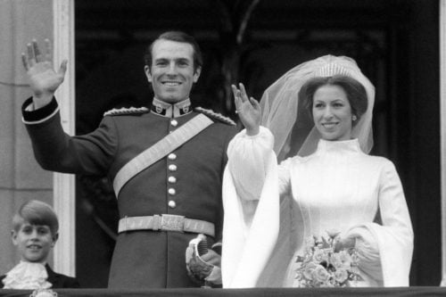 Princess Anne and her husband at her first wedding waving at the crowd. She is in bridal white with the Queen Mary Fringe Tiara.