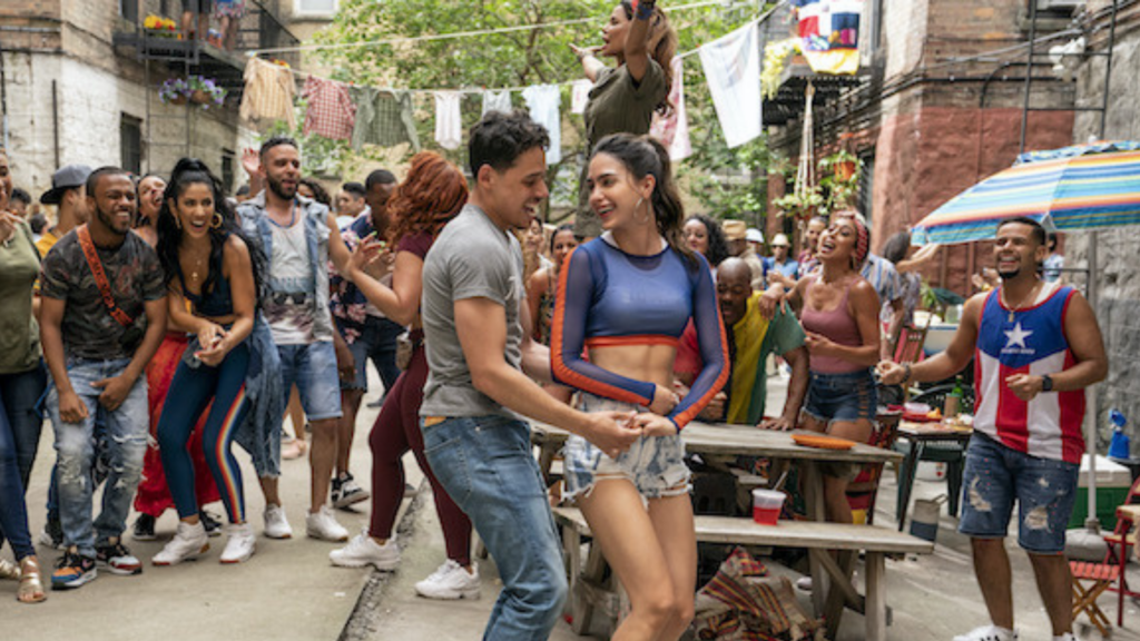 Many-people-dancing-in-the-street-with-a-couple-focused-in-the-center-1024x576.png