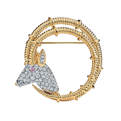 Ibex Brooch in 18k yellow gold and platinum with diamonds.