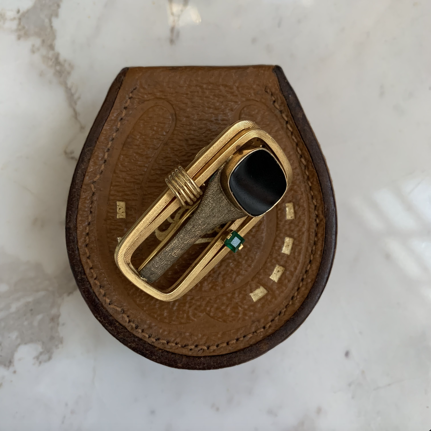 Gold signet ring with onyx brooch.