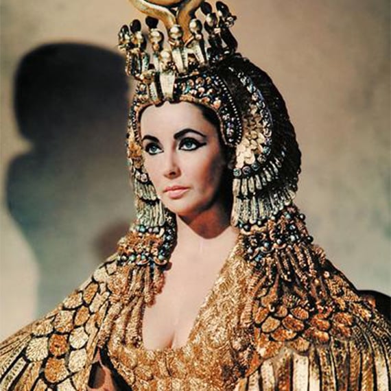 Cleopatra, the actress, wearing peridot gemstones in her head jewels.