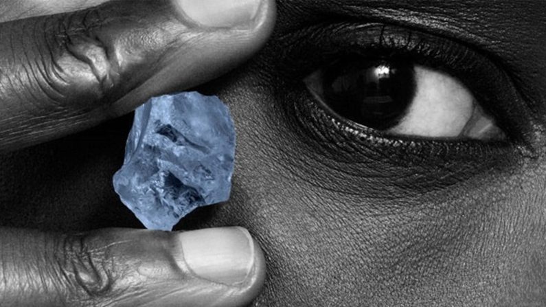 Person holding blue diamond