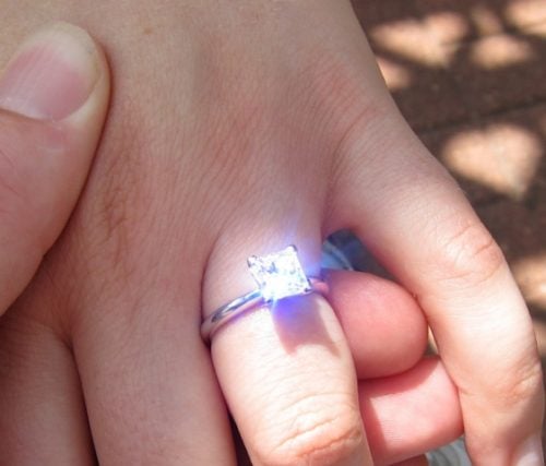 Princess diamond ring, flashing light.