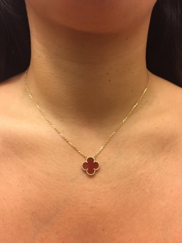 Red lucky 4 leaf clover style pendant.