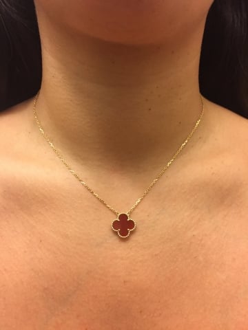 Red lucky 4 leaf clover style pendant.