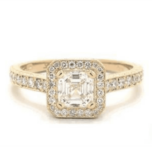 A gold diamond ring with an asscher center stone.