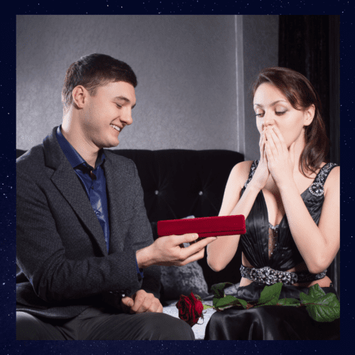 a man gifting a woman with a jewelry box.