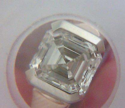 Asscher diamond in a semi bezel, magnified.