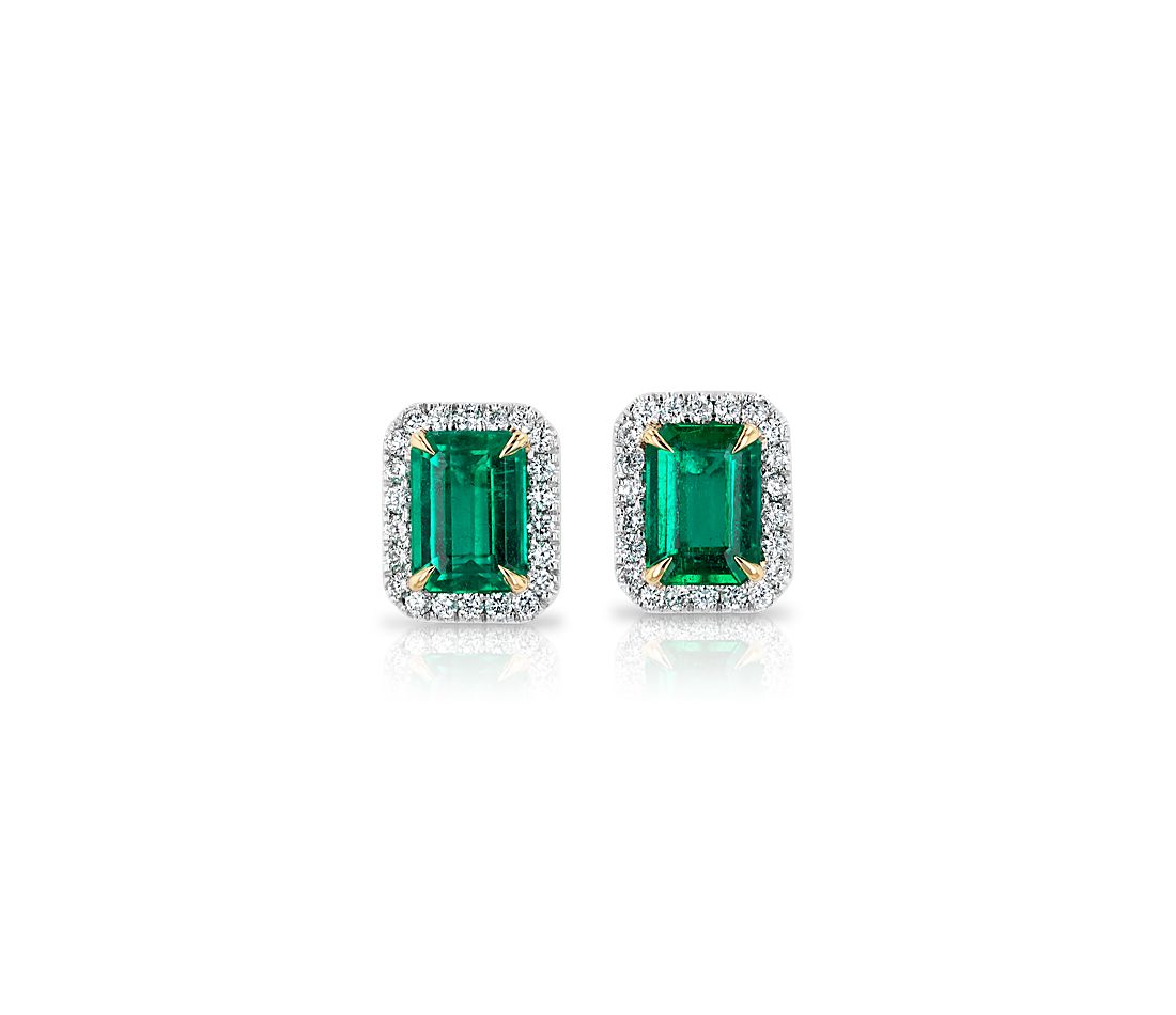 Emerald-Cut Emerald Stud Earrings with Diamond Halo in 14k White Gold with Yellow Gold Prongs.