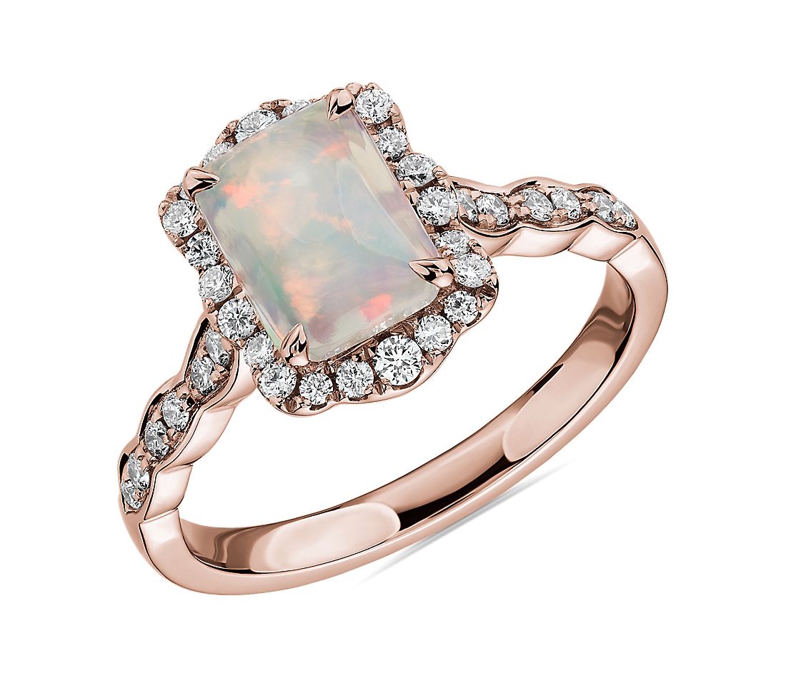 Emerald Cut Opal Ring with Diamond Halo in 14k Rose Gold.