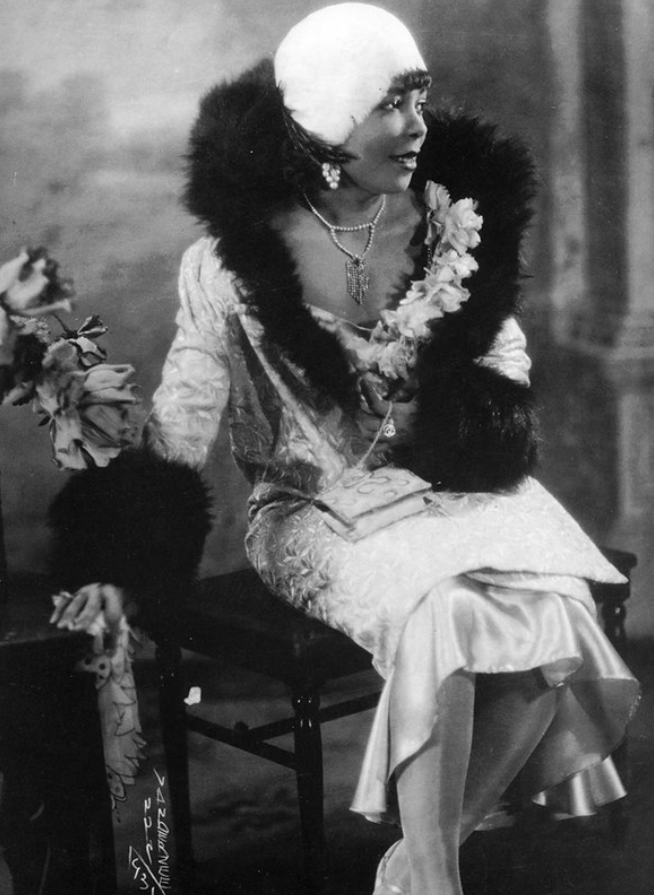 African American Flapper with Fur Shawl Coat.