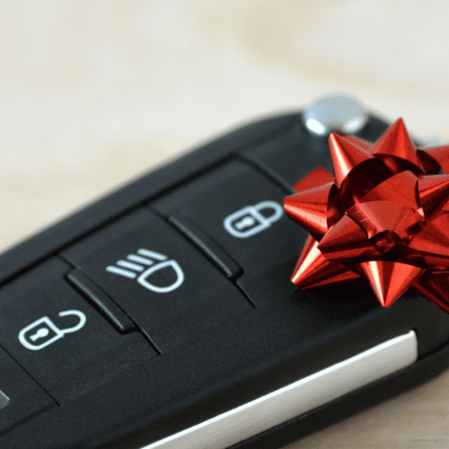 car key fob with a small red bow.