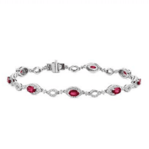 Oval Ruby and Round Diamond Bracelet in 14k White Gold.