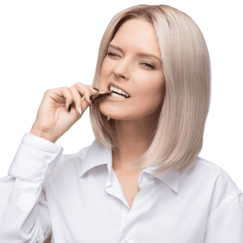 Blonde woman in white button down shirt biting a coin.