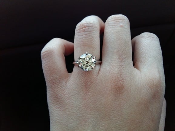 diamond ring on a hand.