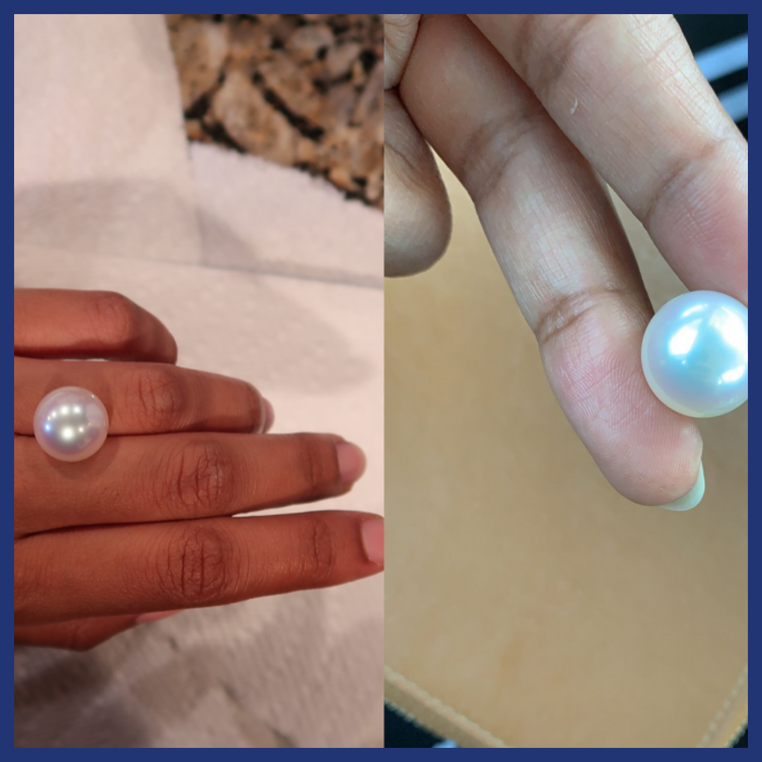 2 images on a large pearl on a female hand.