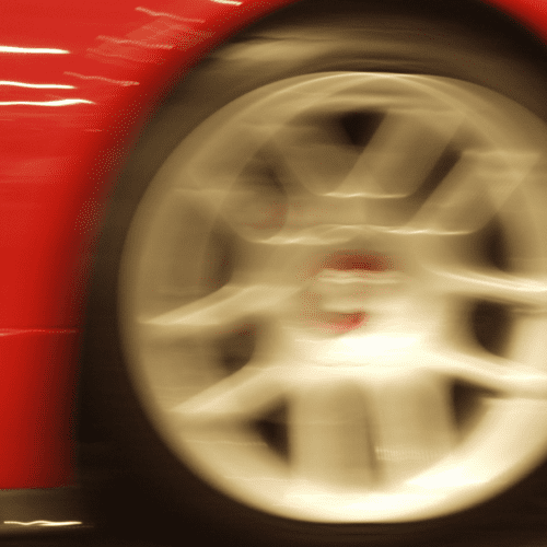 Over zoomed image of a car tire rim.