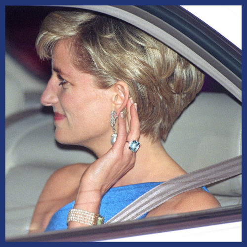 The late Princess Diana wearing an aquamarine ring.