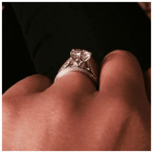 profile of a diamond engagement ring on a hand