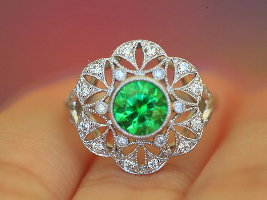 large diamond lacing ring with a center stone of bright green demontoid.