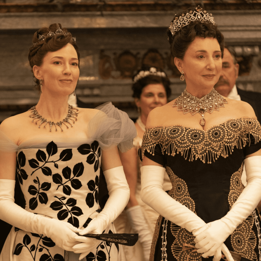 Two women in Gilded Age era costumes