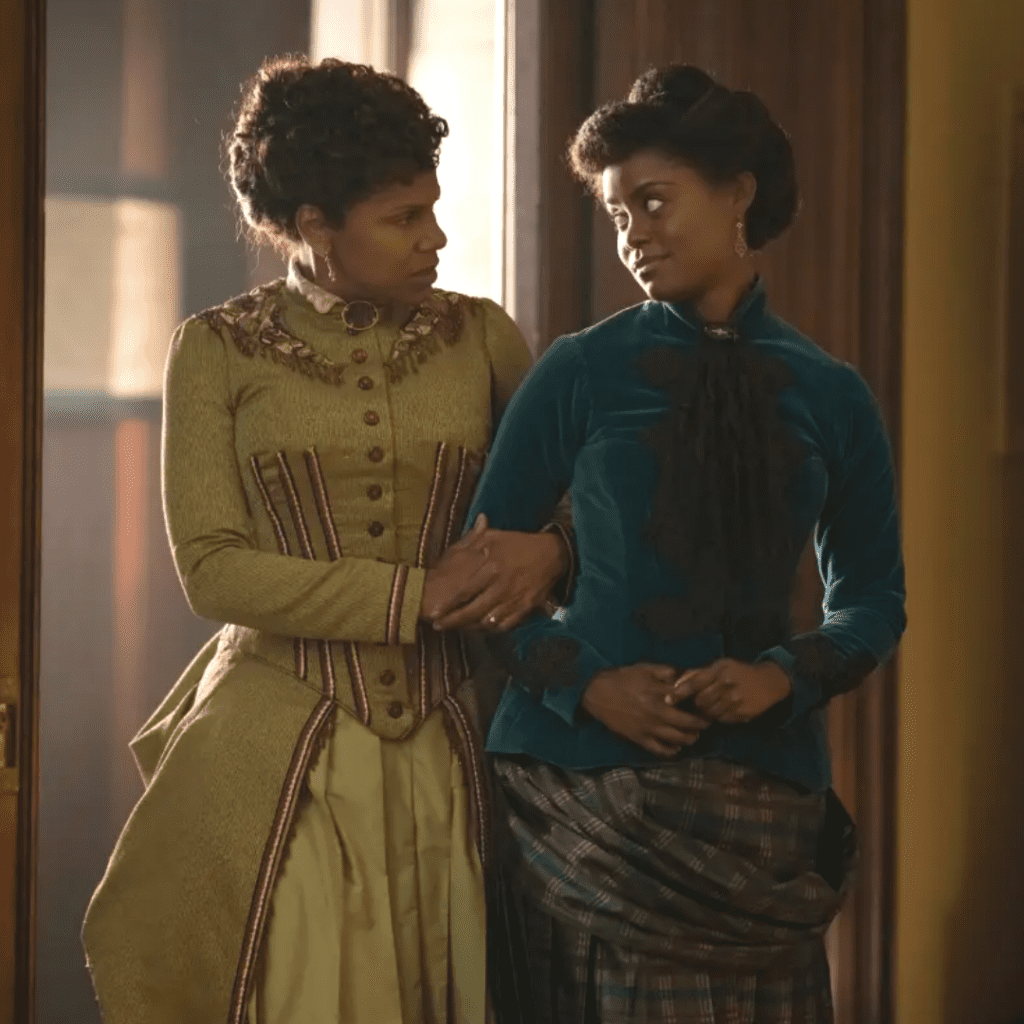 Two women in Gilded Age era costumes