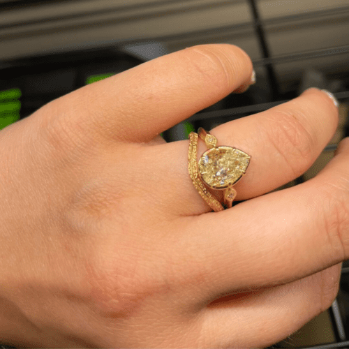 Yellow gold wedding set with an antique pear engagement ring