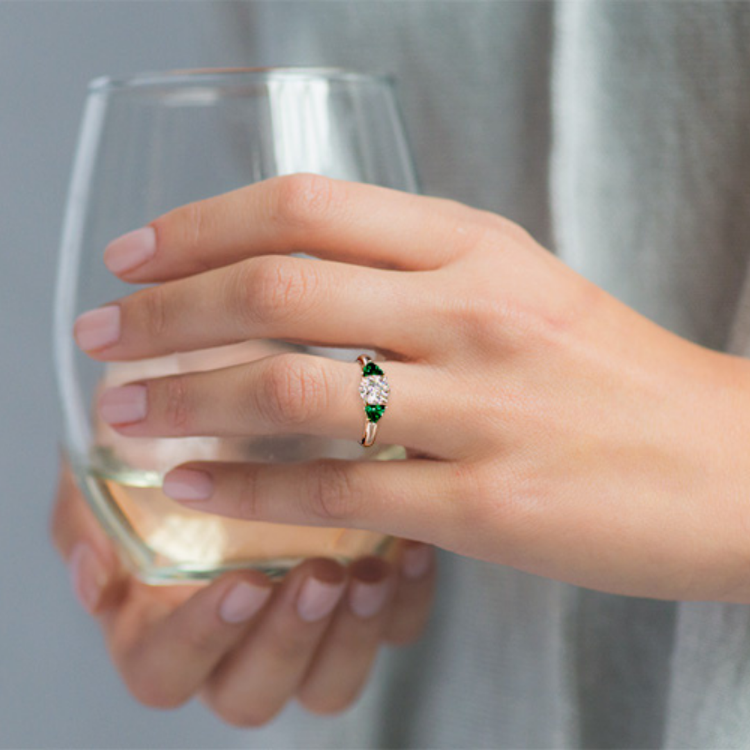 18K White Gold Three Stone Trillion Shaped Emerald Engagement Ring.