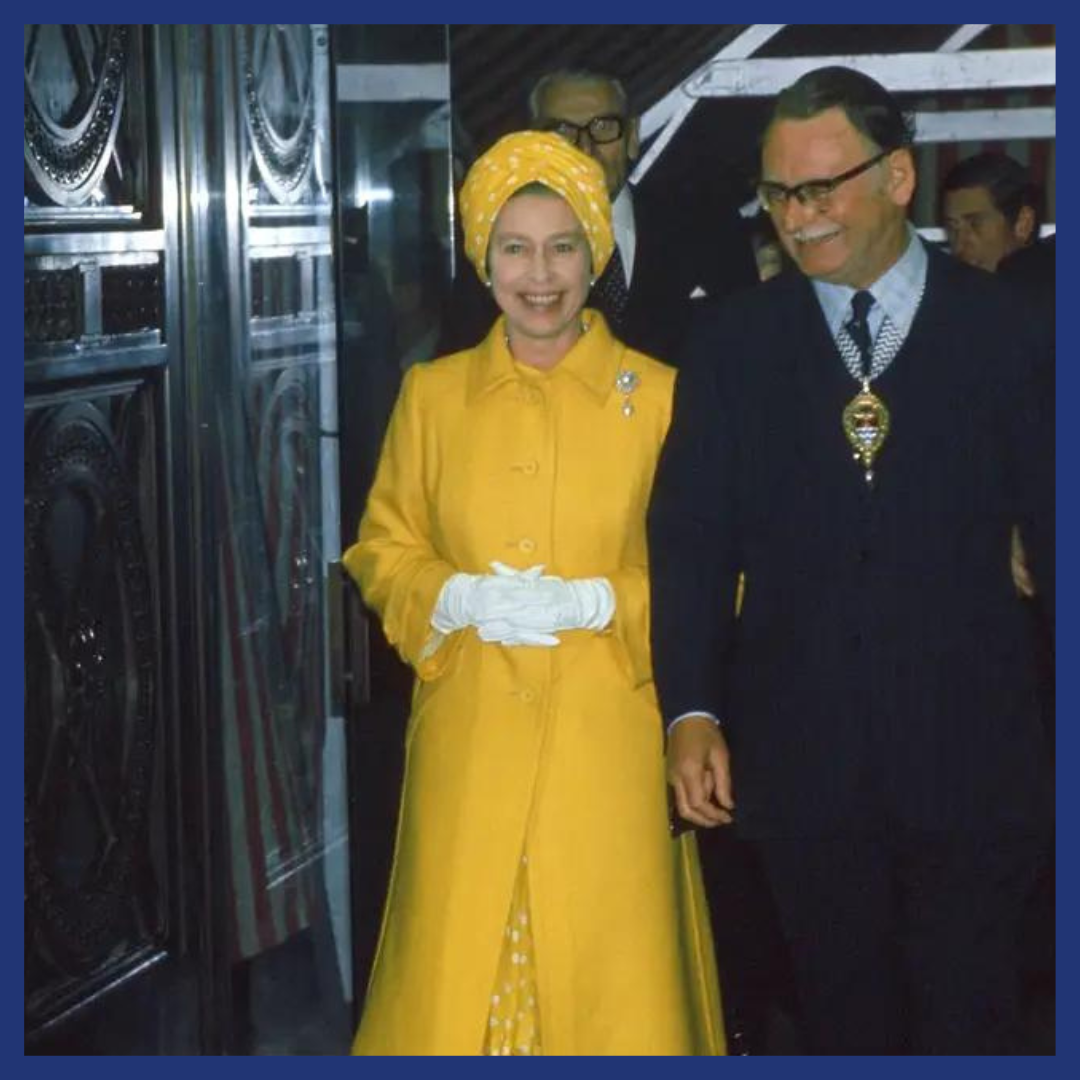 Queen Elizabeth II wearing a striking yellow coat and turban for the River Thames Pageant on June 9, 1977.