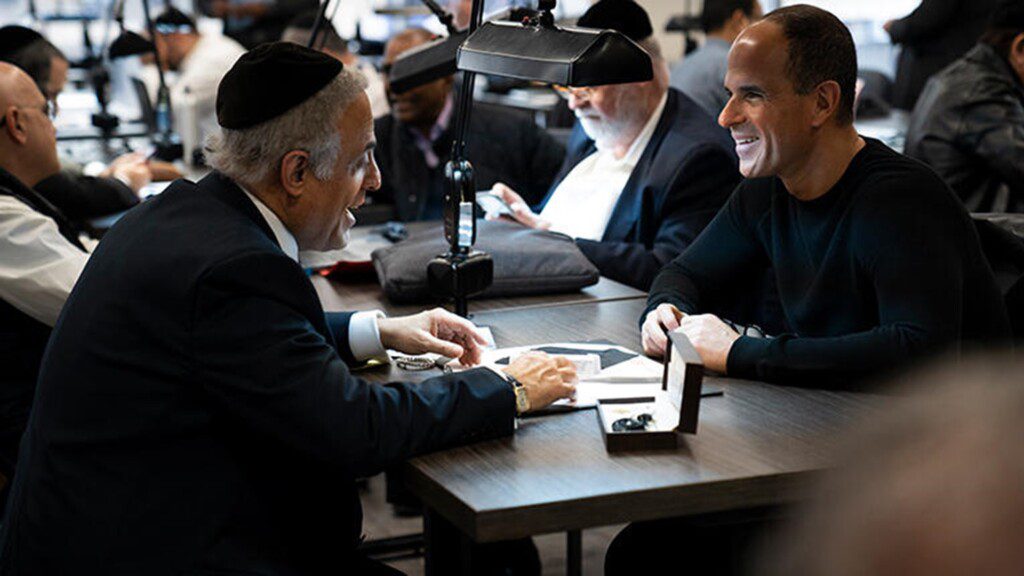 Two men discussing diamonds and their quality in the New York diamond district