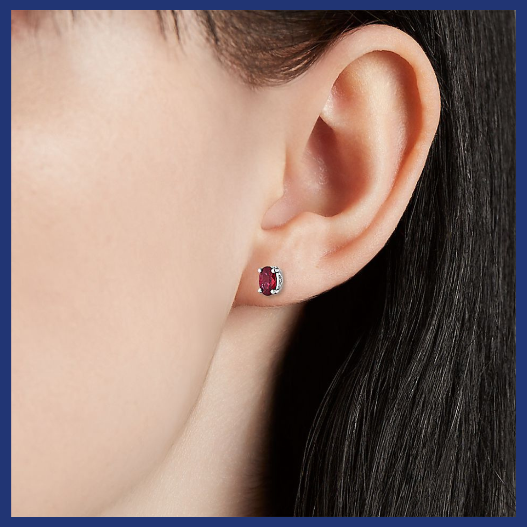 Oval Ruby and Diamond Earrings in 14k White Gold.