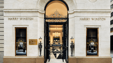 Photograph of Harry Winston store front, white building, luxurious interior