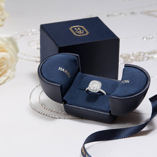 Harry Winston navy ringbox with Halo engagement ring inside