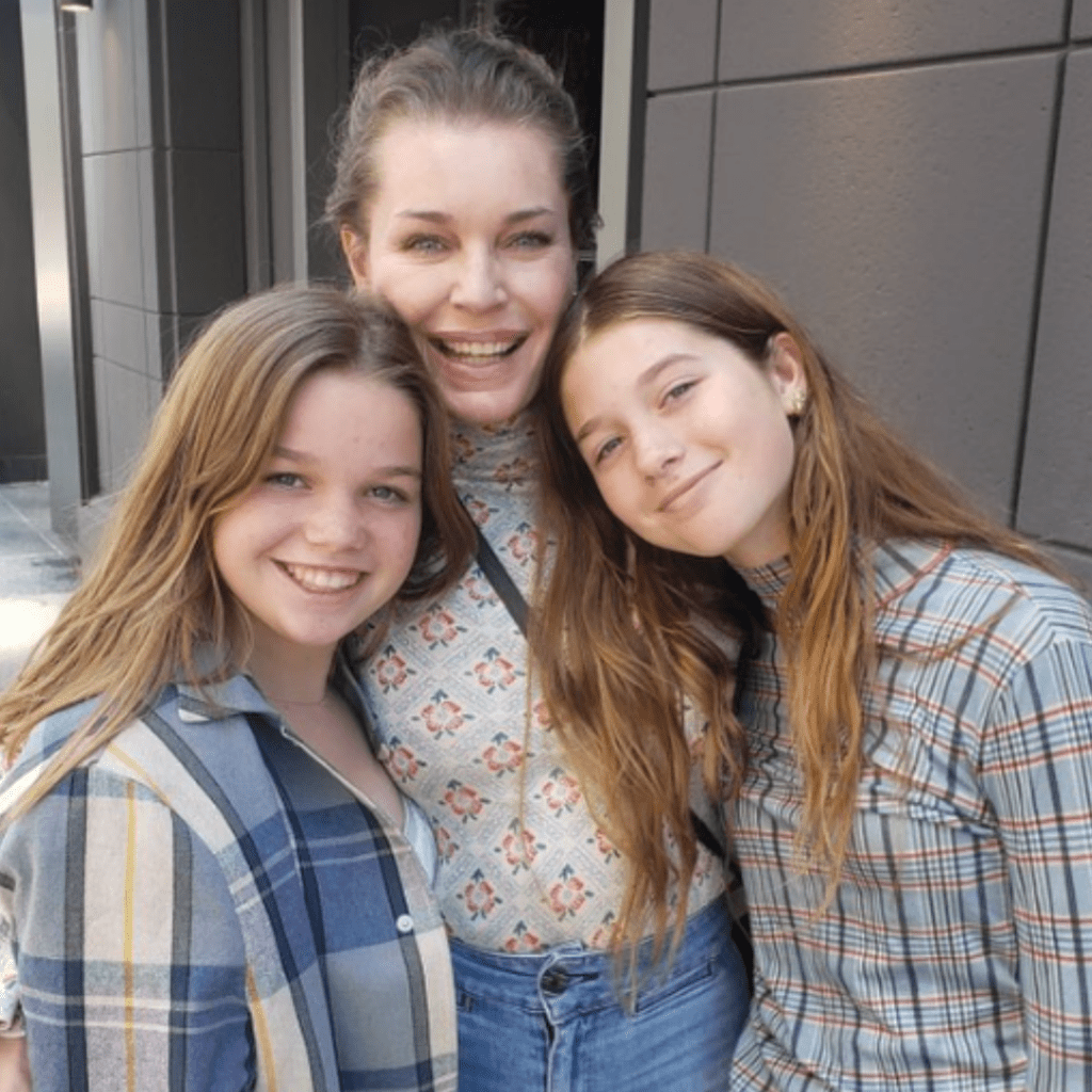 Rebecca Romijn and her twin daughters.