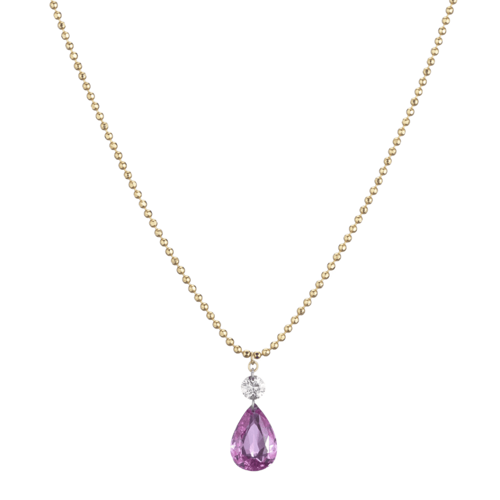 Pink pear stone suspended from round diamond, suspended from gold ball chain.