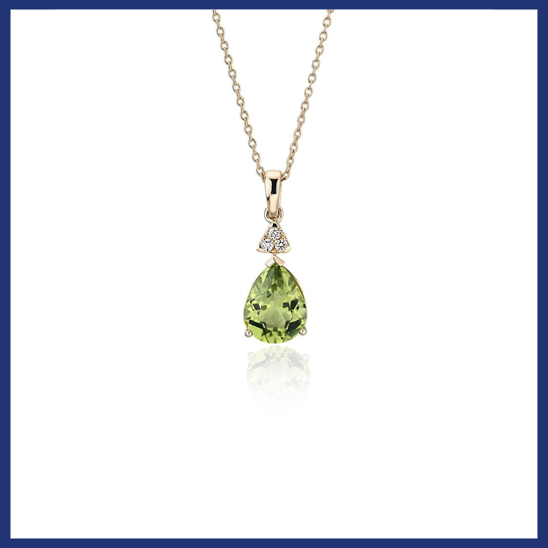 Pear-Shaped Peridot Pendant with Diamond Trio in 14k Yellow Gold.