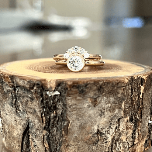 Diamond Wedding Set On A Wooden Stump