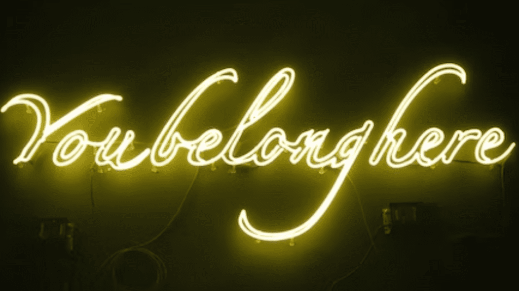 Neon sign reading "You Belong Here"