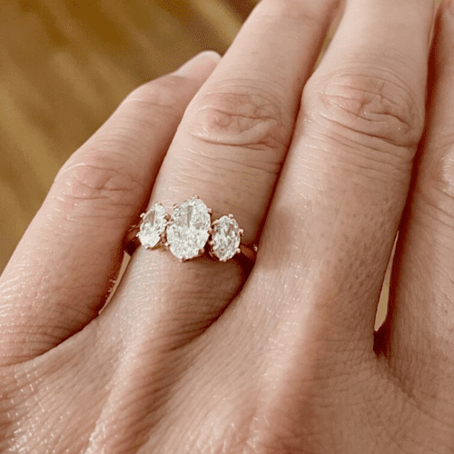 Three-stone oval cut diamond ring
