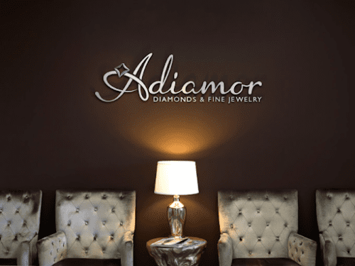 Adiamor, diamonds and fine jewelry on a wall, with comfy armchairs underneath the branding